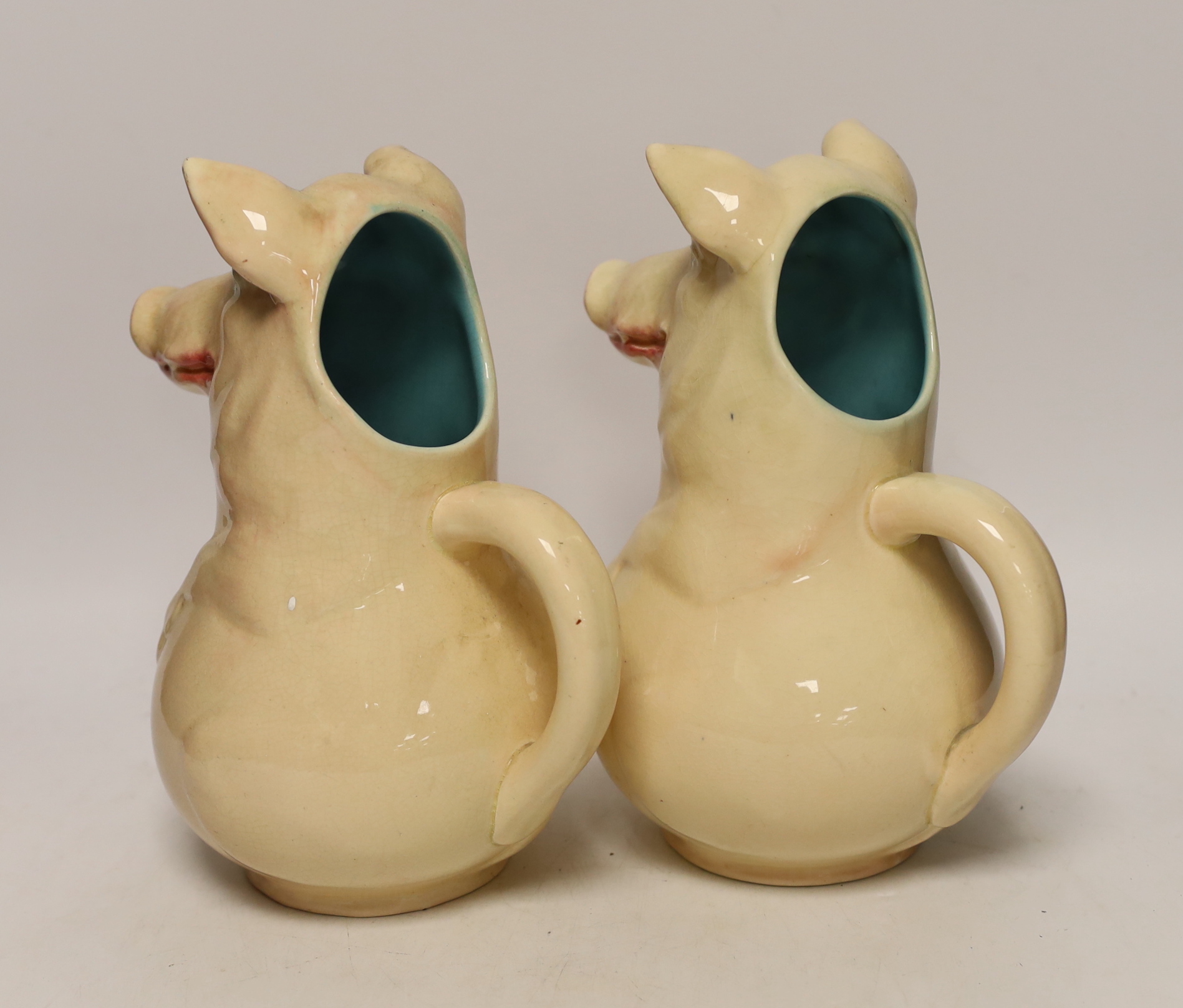 A pair of Sarreguemines ‘pig’ jugs, impressed numbers 3318 to each, 24cm